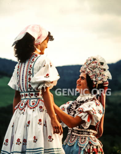 Ladies in folk costumes.