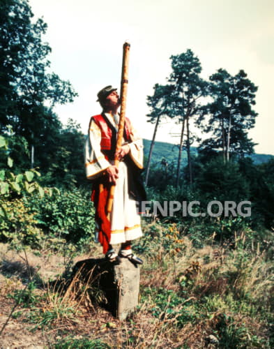 Man playing the fujara - traditional music instrument.