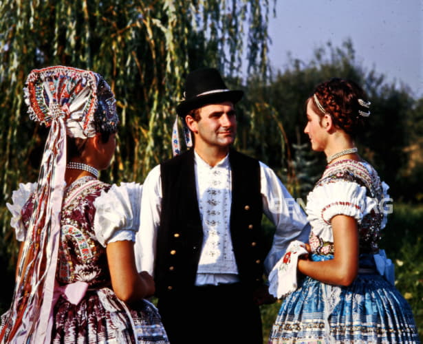 Village people in folk costumes.